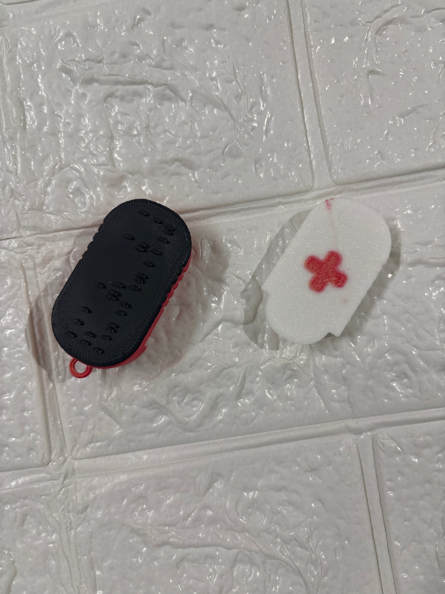 A 3D-printed Braille keychain with a built-in NFC chip — designed for universal accessibility.